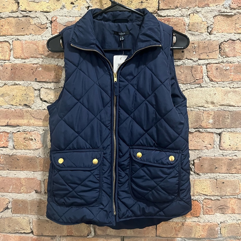 NWT. Francesca’s navy blue vest with gold detailing.